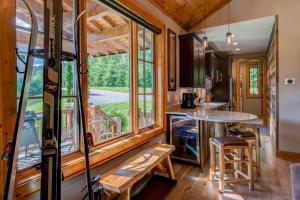a tiny house with a kitchen and a large window at Banner View in Banner Elk