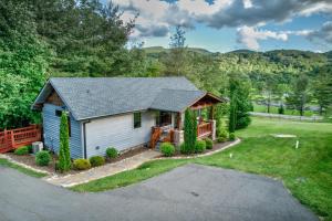 a home with a driveway and a house at Banner View in Banner Elk