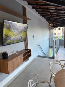 TV a/nebo společenská místnost v ubytování Kitnet em cobertura Bom Despacho-MG