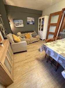 a living room with a couch and a table at Anayet Sweet Home in Formigal