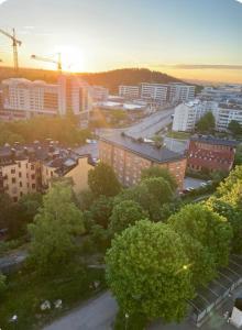 an overhead view of a city with buildings and trees at Wesfield Private in Solna
