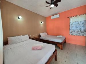 Ένα ή περισσότερα κρεβάτια σε δωμάτιο στο Ometepe House