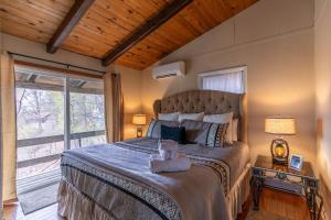 a bedroom with a large bed with a large window at Bear Valley in Fleetwood