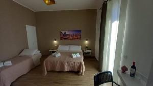 Giường trong phòng chung tại Casa Vacanze Cipriano