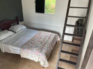 Ένα ή περισσότερα κρεβάτια σε δωμάτιο στο Casa Reserva Encantada