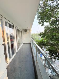 an empty balcony of a building with a view at The Nuvon Residency CR Park in New Delhi