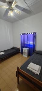 Postel nebo postele na pokoji v ubytování Residencial La Familia