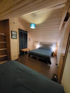 Postel nebo postele na pokoji v ubytování Le Chalet de l'Ancerf