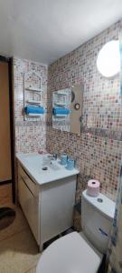 a bathroom with a toilet and a sink at Appartement meublé à louer in Meknès