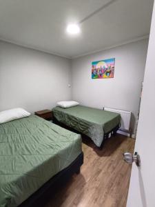 Ένα ή περισσότερα κρεβάτια σε δωμάτιο στο La Casita Angamos