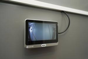 a computer monitor is hanging on a wall at Stylish smart studio in Tallinn