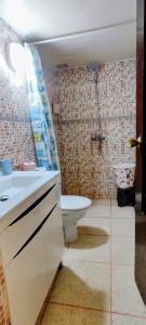 a bathroom with a sink and a toilet in a room at Appartement meublé à louer in Meknès +24 photos