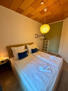 Postel nebo postele na pokoji v ubytování Zentrumsnah - gemütliches Apartment im Ringgebiet