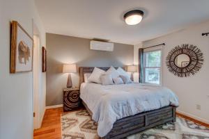 a bedroom with a bed and a window at The Wander Inn in Blowing Rock