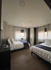 Ένα ή περισσότερα κρεβάτια σε δωμάτιο στο Pine Country Farm Stay