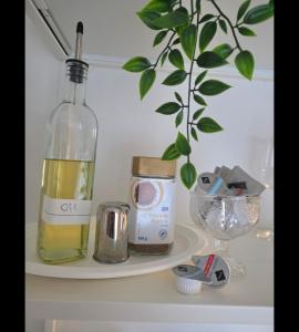 a bottle of wine sitting on top of a shelf at Modern Living Apartment Hotel in Nürnberg