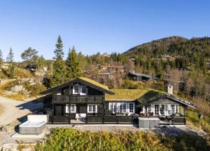 an image of a house with a grass roof at Family Cabin With Jacuzzi At Tempelseter in Eggedal