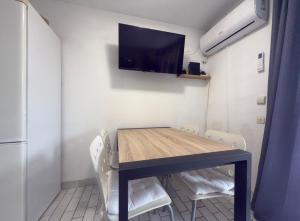 Et tv og/eller underholdning på L'Alhambra - Plage à Pied Piscine