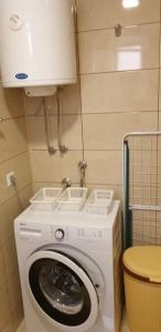 a washer and dryer in a small room at Daily rental apartment Travnik in Travnik