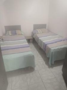 Ένα ή περισσότερα κρεβάτια σε δωμάτιο στο Apartaestudio amoblado PIMSA