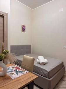 En eller flere senge i et værelse på Near Naples Caserta Center