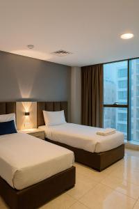 Ένα ή περισσότερα κρεβάτια σε δωμάτιο στο al AMER palace hotel by al Jamal