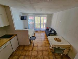 a small room with a bed and a couch at Kyra-Apartaments FronteraBL HUT2-6074 in Pas de la Casa +7 photos