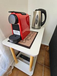 a white table with a toaster and a coffee maker at Kyra-Apartaments FronteraBL HUT2-6074 in Pas de la Casa