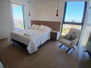 Postel nebo postele na pokoji v ubytování Mirador en Macororo 15, Piso 20 + 48 fotografií