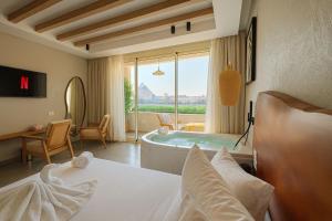 Ένα ή περισσότερα κρεβάτια σε δωμάτιο στο ONE GATE Pyramids View INN