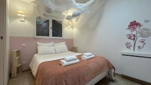 Postel nebo postele na pokoji v ubytování Le petit Cocon - Centre-ville