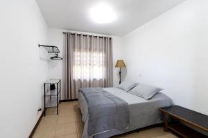 En eller flere senge i et værelse på Edicula aconchegante privativa em Sousas, Campinas + 52 billeder