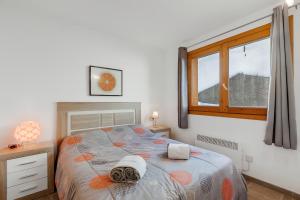 Ένα ή περισσότερα κρεβάτια σε δωμάτιο στο El Tarter Ski Apartment for Families - Happy Rentals