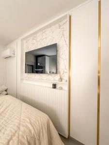 Ένα ή περισσότερα κρεβάτια σε δωμάτιο στο Apartamento Pé na areia