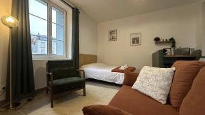 Posezení v ubytování Le Petit Oasis - 50m de la gare de Nevers