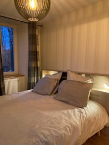 Ένα ή περισσότερα κρεβάτια σε δωμάτιο στο Le Goulet