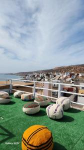 a group of pillows sitting on top of a ship at Rock Surf Hostel Taghazout in Taghazout