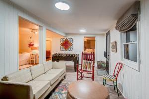 a living room with a couch and a table at Orchid Cabin in Banner Elk