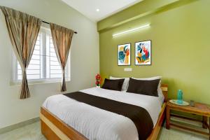 Ліжко або ліжка в номері Townhouse Svb Tech Park Kalapatti Formerly RG Stays