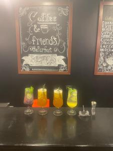 a table with four glasses of drinks on it at vision suites Arbia Hurghada in Hurghada