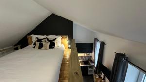 Postel nebo postele na pokoji v ubytování Le petit Terminus - Proche de la gare de Nevers