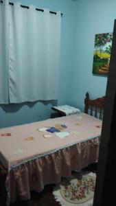 Ένα ή περισσότερα κρεβάτια σε δωμάτιο στο Casa doce Lar