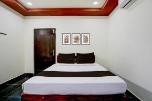 a bedroom with a large bed in a room at Collection O Chirala Beach View Formerly Sea Shell Resort in Vadarevu
