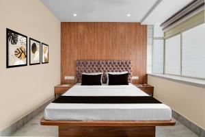 Ένα ή περισσότερα κρεβάτια σε δωμάτιο στο Hotel O Netaji Metro Station Kolkata Formerly Mahamaya Step Inn