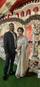 un hombre y una mujer posando para una foto en Suite property insurance groups of company, en Dhaka