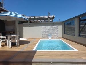 Hồ bơi trong/gần Casa Com Piscina Pertinho Do Mar Em Capão Da Canoa