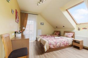 Postel nebo postele na pokoji v ubytování Vila Liepa