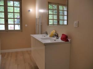 a bathroom with a sink and a mirror at Domaine la Pause in Aveyron in Vabres-lʼAbbaye +18 photos