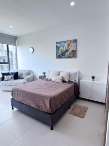 Ένα ή περισσότερα κρεβάτια σε δωμάτιο στο ApartaSuite con vista al Mar