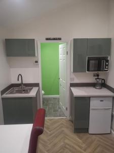 Kuchyň nebo kuchyňský kout v ubytování Millhouse Property